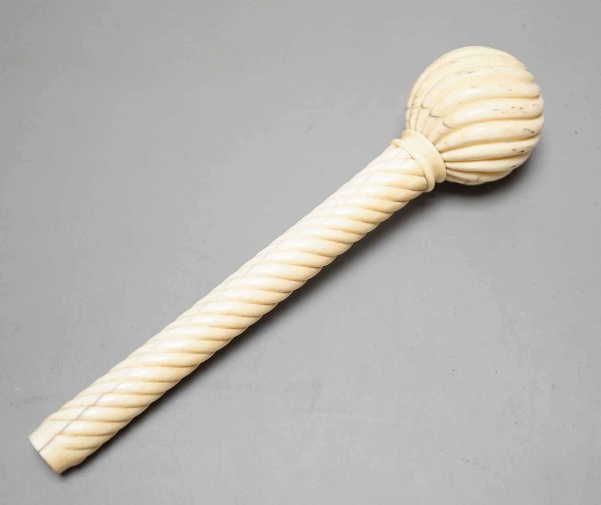 A 19th century Ivory parasol handle, 17 cms long.